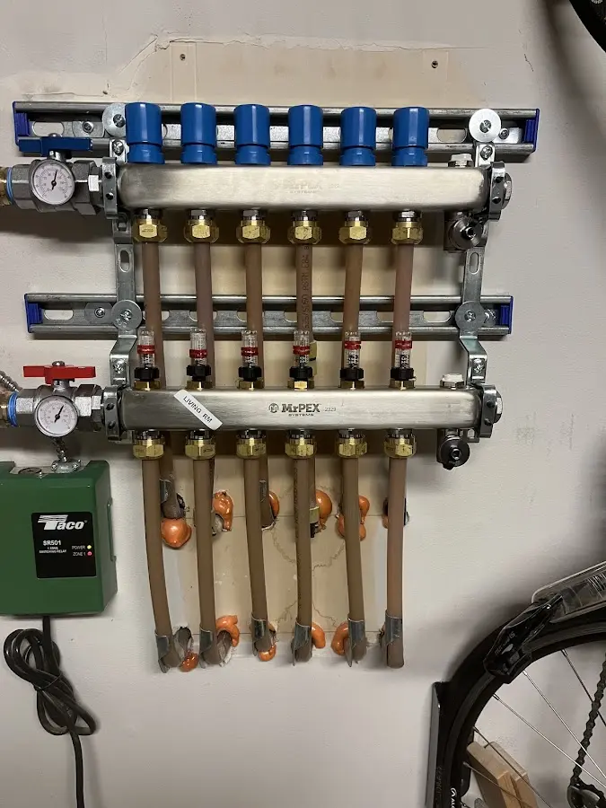 Plumber performing Water Heater Repair at a residential property in Black River Falls